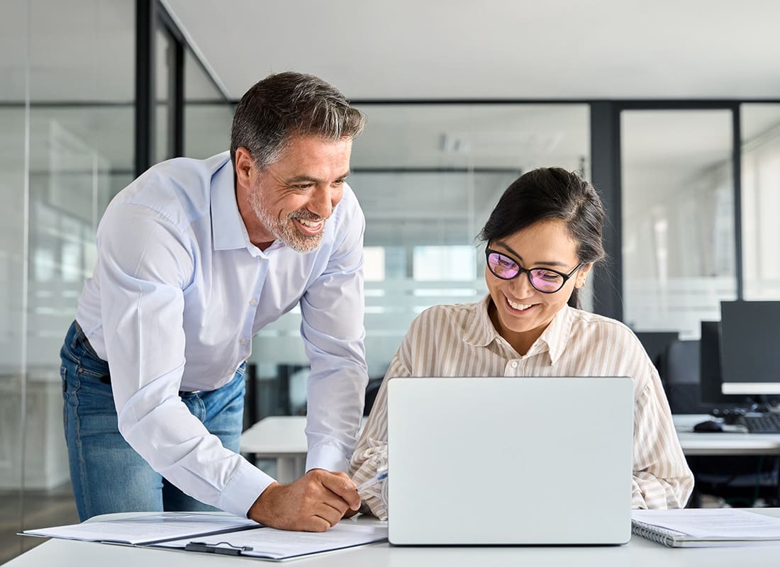 Contact - Two Business Professionals Working in an Office