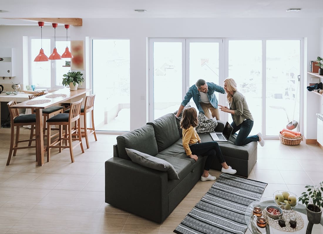 Personal Insurance - Happy Family Spending Time Together at Home